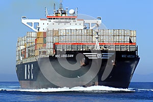 Big container ship MSC ABIDJAN sailing in open waters.