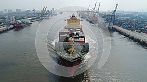 Container Ship Navigating Busy Cargo Port