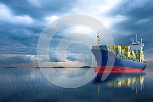 Container ship in ocean on storm sky .