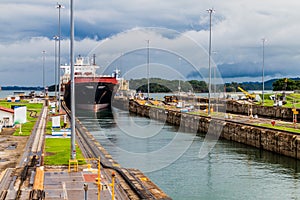 Container ship is passing through Gatun Locks, part of Panama Can