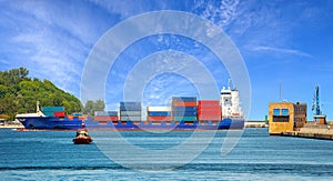 Container ship with pilot boat