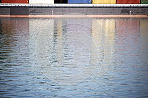 Container ship reflected in the river