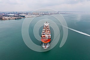 container ship sailing to transport goods in containers for import export internationally and worldwide, business services
