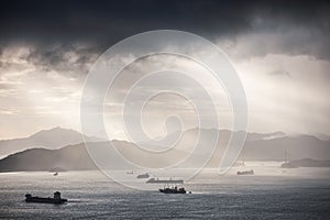 Container ships in ocean, South China Sea, Sunset