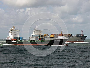 Container ships sailing towards port