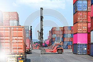 Container stacker, load the container into the truck. Transportation concept