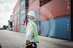 Container Supervisor Control Import/Export While Inspecting Containers Box in Warehouse Storage Distribution. Container Logistics