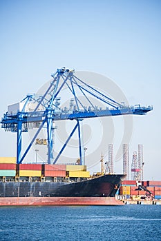 Container terminal, with cranes, in a commercial port