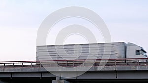 Container truck on the highway bridge.