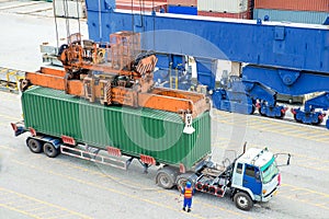 Container truck waiting for loading container box to Cargo ship