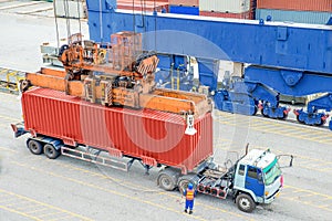 Container truck waiting for loading container box to Cargo ship