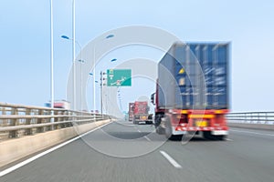 Container trucks on bay bridge