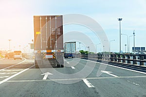 Container trucks Logistic by Cargo truck on the road
