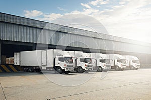 Container Trucks Parked Loading Package Boxes at Dock Warehouse. Warehouse Shipping. Freight Truck Logistics, Cargo Transport.