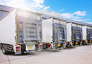 Container Trucks on The Parking Lot at Warehouse. Lifting Ramp Trucks. Freight Truck Logistics Cargo Transport