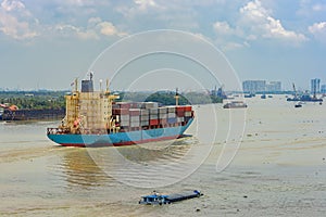 Container vessel sails upstream the Song Long River.