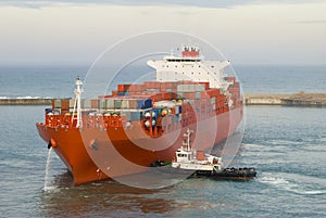 Container vessel and a small tug boat