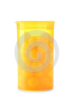 Container with yellow pills on white background