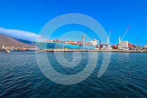 Containers being loaded in a cargo ship