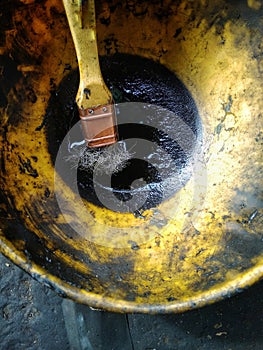 Containers and brushes that are soiled with oil