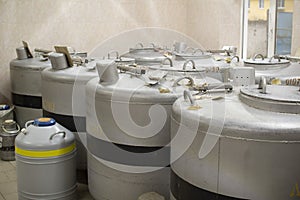 A can of liquid nitrogen containing straws for fertilizing cows.
