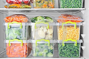 Containers with deep frozen vegetables