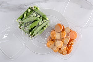Packaged fresh vegetables for tasty healthy snack on the white surface.Top view shot