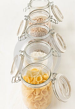 Containers full with pasta, rice, chickpeas. Healthy food ingredients.