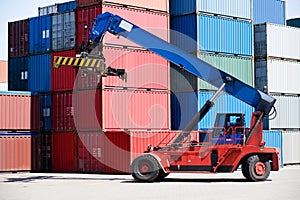 Containers in port with handler photo