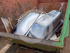 Containers with scrap iron bathtubs