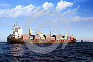 Containership Calais Trader anchored in Algeciras bay in Spain.