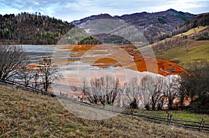 Contaminated lake full with mining residuals in Rosia Mont photo