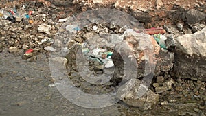 Contamination of the sea. Piles of garbage waste environmental disaster on a sea shore.