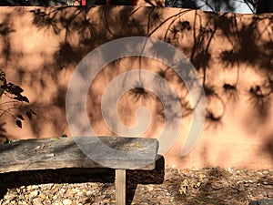 Contemplative adobe wall and stone bench