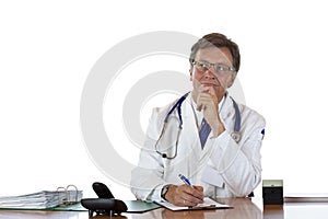 Contemplative aged doctor at desk