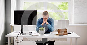 Contemplative Business Man At Desk