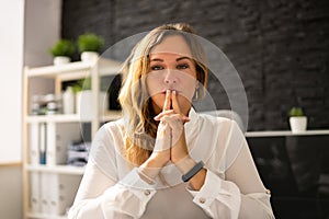 Contemplative Business Woman At Desk