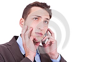 Contemplative businessman talking on phone