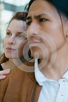 Contemplative couple enjoying urban scenery together