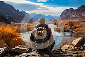 A Contemplative Moment: Man Sitting on Rock, Gazing at Serene River