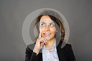 Contemplative smiling businesswoman