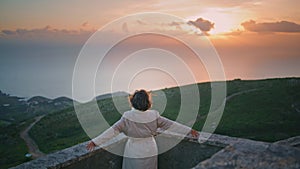 Contemplative woman looking sunset horizon leaning railings. Lady traveler