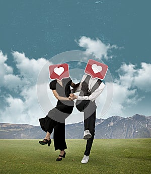 Contemporary art collage of couple with like icons head dancing isolated over nature, mountain background