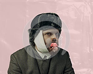 Contemporary art collage. Portrait of bearded man playing famous artist Van Gogh with dog's mouth isolated on pink
