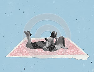 Contemporary art collage. Young woman and little girl lying on pink paper carpet isolated over blue background