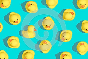 contemporary art style pattern of small rubber duckies in a vibrant summery color palette