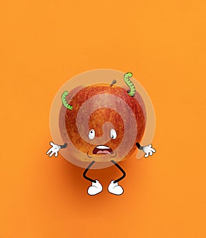 Contemporary artwork. Cute sad red apple thinking isolated over orange background. Drawn fruit in a cartoon style