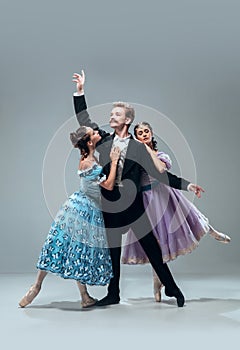 Contemporary ballroom dancers on grey studio background