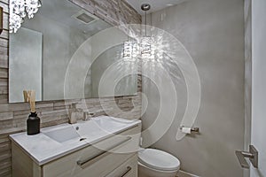 Contemporary bathroom design with taupe linear tiles accent wall