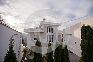 Contemporary beautiful modern white house exterior, smart